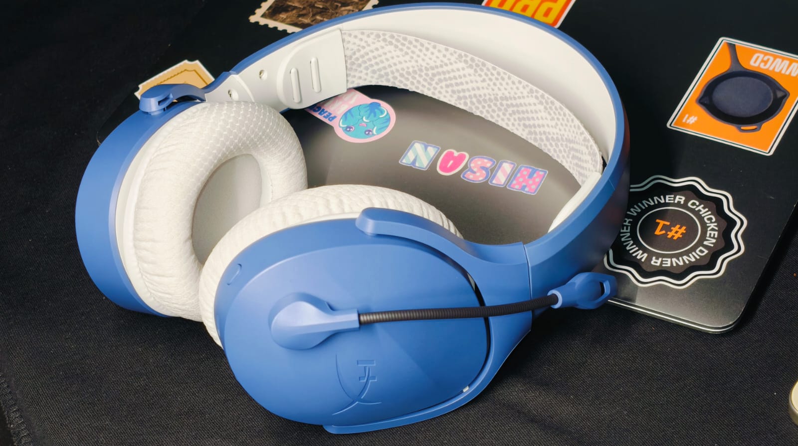 The HyperX Cloud Jet Dual Wireless Are The Best Budget HyperX gaming headphones lying on top of a MacBook